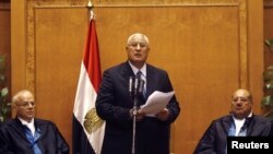 Adly Mansour (C), Egypt's chief justice and head of the Supreme Constitutional Court, speaks at his swearing in ceremony as the nation's interim president in Cairo, July 4, 2013, a day after the army ousted Mohamed Morsi as head of state.