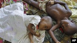Two children with malaria rest at the local hospital in the small village of Walikale, Congo (file photo)