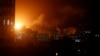 An explosion caused by Israeli airstrikes is seen from Hamas security building in Gaza City, March 25, 2019. 