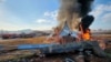 Firefighters douse flames from a plane that went off the runway at Muan International Airport in Muan, South Jeolla Province, South Korea, Dec. 29, 2024. 