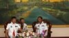 Tea Vinh, commander of the Royal Cambodian Navy (R), welcomes Yu Manjiang, commanding officer of the Chinese fleet visiting Cambodia, in Phnom Penh, Feb. 24, 2016.