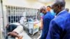 Lagos State Goveror Babajide Sanwo-Olu visits injured people at a hospital in Lagos, in this handout picture obtained by Reuters on Oct. 21, 2020, Nigeria. 