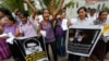 FILE - Sri Lankan women shout slogans during a protest in Colombo, Sri Lanka, Jan. 11, 2013, condemning the execution of Sri Lankan domestic worker Rizana Nafeek in Saudi Arabia. Saudi authorities said Rizana Nafeek has been executed for killing a Saudi baby in her care in 2005.