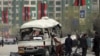 FILE - Security personnel inspect the site of a bomb attack in Kabul, Afghanistan, March 15, 2021.
