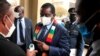 Zimbabwe's President Mnangagwa has his temperature taken as he arrives at the parliament in Harare, April 20, 2021.