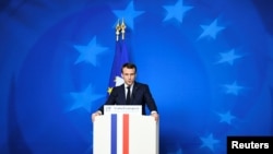 FILE - French President Emmanuel Macron attends a news conference after a European Union leaders summit in Brussels, Belgium Dec. 14, 2018.