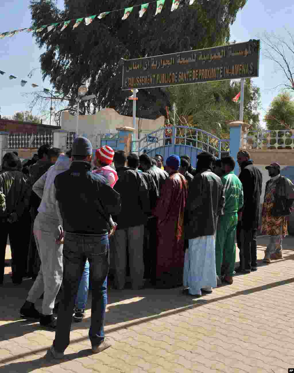 Residents of Ain Amenas, Algeria, gather outside the hospital trying to get information concerning relatives wounded during the terrorist attack at the gas plant, January 18, 2013.
