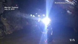 Rescuers Walk in Thai Cave to Carry Out Evacuation