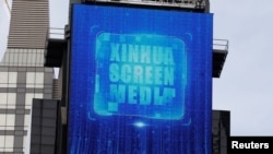A screen advertising Xinhua News Agency is seen in Times Square in the Manhattan borough of New York City, New York, March 2, 2020.
