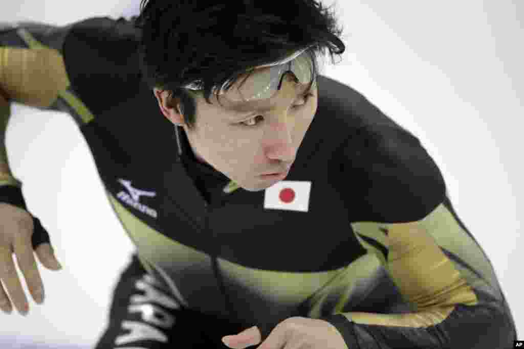 Yuji Kamijo of Japan practices his start for the men's 500-meter speedskating race at the Adler Arena Skating Center, Sochi, Russia, Feb. 10, 2014.