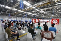 People wait to be vaccinated against the coronavirus disease (COVID-19) during a vaccination session organized by the local Taiwan Affairs Office in Nanchang, Jiangxi province, China June 4, 2021.