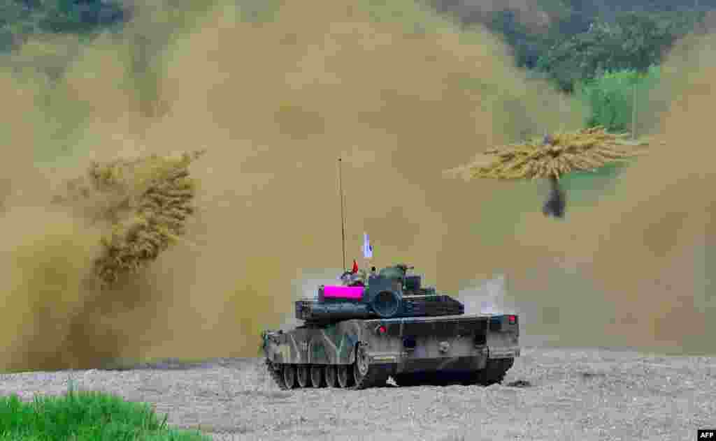 South Korea's K-1 tank fires smoke shells during a joint military drill between U.S. and South Korean Marines in the southeastern port of Pohang.