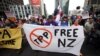 Protesters march to the venue of the Trans-Pacific Partnership signing in Auckland, New Zealand, Feb 4, 2016.