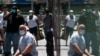 FILE - People wear masks to prevent the spread of coronavirus, as the delta variant has led to a surge in infections, in New York City, July 30, 2021. 