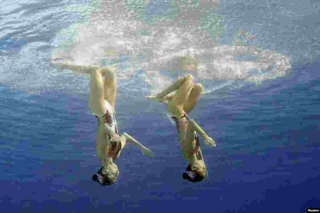 Anna-Maria Alexandri (AUT) and Eirini-Marina Alexandri (AUT) of Austria compete perform in the synchronized swimming duet free routine in Rio de Janeiro, Brazil.