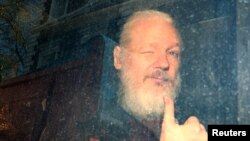WikiLeaks founder Julian Assange arrives at the Westminster Magistrates Court, after he was arrested in London, Britain, April 11, 2019. 