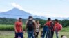Migrants pause on the shoulder of a road on the outskirts of Tapachula, Chiapas state, Mexico, Nov. 20, 2024, during their journey to the U.S. border.