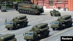 FILE - Russian S-400 surface-to-air missile defense systems are on display during a parade at Red Square in Moscow, Russia, May 9, 2015.