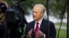 FILE - White House trade adviser Peter Navarro speaks during a television interview at the White House, Oct. 8, 2019.