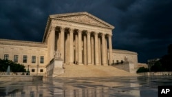 FILE - The Supreme Court is seen under stormy skies in Washington.