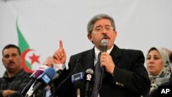 FILE - Ahmed Ouyahia, who was then Algeria's prime minister, speaks during a meeting of the National Democratic Rally in Algiers, May 5, 2012. 