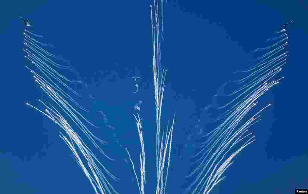 Russian-made Sukhoi Su-27 fighters of Kazakhstan's Air Force drop flares during the opening ceremony of the International Army Games 2016 at Gvardeisky Range, Kazakhstan, August 2, 2016.