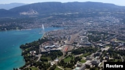 FILE - The buildings of the European headquarters of the United Nations are seen in front of the city of Geneva with Lake Leman and the Jet d'Eau fountain.
