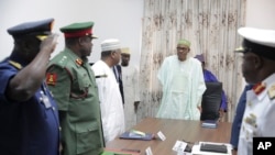Nigerian President Muhammadu Buhari presides at a meeting with his nation's service chiefs in Abuja, June 2, 2015. 