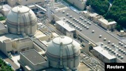 FILE - An aerial view shows Kansai Electric Power Co's Ohi nuclear power plant's No. 4 reactor (front) in Ohi, Fukui prefecture.