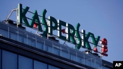 FILE - A sign is seen above the headquarters of Kaspersky Lab in Moscow, Russia, Jan. 30, 2017.