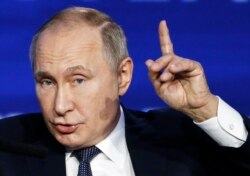 FILE - Russian President Vladimir Putin speaks during an annual VTB Capital "Russia Calling!" investment forum in Moscow, Nov. 20, 2019.