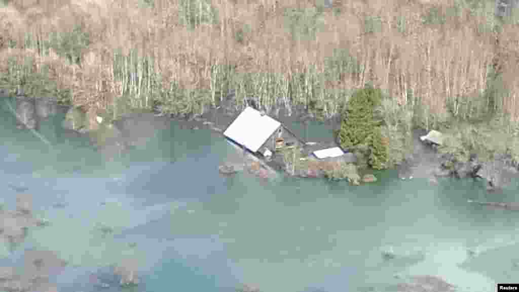An aerial view of the area affected by a landslide near State Route 530 is seen in this photo provided by Governor Jay Inslee&#39;s office, taken near Oso, Washington March 23, 2014.