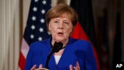 German Chancellor Angela Merkel speaks during a news conference with President Donald Trump in the East Room of the White House, April 27, 2018, in Washington.