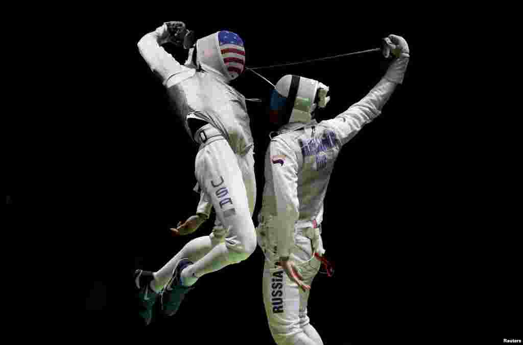 Miles Gerek Meinhardt (USA) of USA competes with Artur Akhmatkhuzin (RUS) of Russia in a foil fencing event at the Olympics in Rio de Janeiro, Brazil