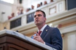 FILE - Oklahoma Gov. Kevin Stitt in Oklahoma City, February 3, 2020. Stitt said hydroxychloroquine was showing some promise in early March, and he didn't want Oklahoma to miss out.