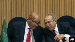 S. African President and Chairperson of the AU Committee on Libya, Jacob Zuma, left, talks with Ramtane Lamamra, African Union Commissioner for Peace and Security in Addis Ababa, Ethiopia, August 26, 2011 during a conference on Libya.