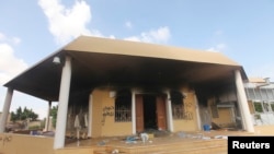 FILE - An exterior view shows the U.S. consulate in Benghazi, Libya, a day after it was attacked and set on fire September 11, 2012.