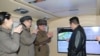 북한이 11일 김정은 국무위원장이 참관한 가운데 극초음속미사일 시험발사에 성공했다며 사진을 공개했다.