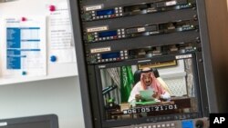 FILE - King Salman of Saudi Arabia is seen on a video screen remotely addressing the 75th session of the U.N. General Assembly, Sept. 23, 2020, at U.N. headquarters.
