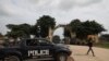 A police truck is stationed outside the University of Abuja Staff Quarters gate where unknown gunmen kidnapped two university professors, lecturers and their family members in Abuja, Nigeria, Nov. 2, 2021.