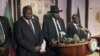 South Sudan President Salva Kiir (C), flanked by former rebel leader Riek Machar (L) and other government officials, addresses a news conference at the Presidential State House in Juba, South Sudan, July 8, 2016. 