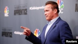 Host Arnold Schwarzenegger poses after a panel for "The Celebrity Apprentice" in Universal City, California, Dec. 9, 2016. 