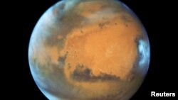 FILE - The planet Mars is shown May 12, 2016 in this NASA Hubble Space Telescope view when it was 50 million miles from Earth.