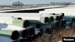 FILE - A depot used to store pipes for TransCanada Corp.'s planned Keystone XL oil pipeline is seen in Gascoyne, North Dakota, Nov. 14, 2014. 