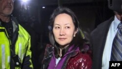 FILE - Huawei Technologies Chief Financial Officer Meng Wanzhou is pictured as she exits the court registry following a bail hearing at British Columbia Superior Courts in Vancouver, British Columbia, Dec. 11, 2018.