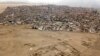 Rumah-rumah di distrik Lurin berdiri di dekat situs arkeologi pra-Columbus Pachacamac di Lima, Peru, 5 Oktober 2017. (Foto: AP)