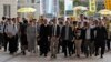 Occupy Central leaders from right; Shiu Ka Chun, Lee Wing Tat, Raphael Wong, Benny Tai, Chan Kin-man, Chu Yiu-ming, Tanya Chan, Eason Chung and Tommy Cheung arrive a court in Hong Kong, April 9, 2019. 