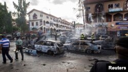 Bekas serangan militan di Abuja (25/6) lalu. Militan kembali menyerang Nigeria utara Minggu (29/6). 