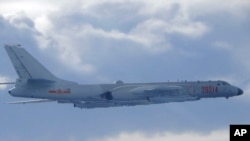 In this photo released by the Taiwan Ministry of National Defense, a Chinese People's Liberation Army H-6 bomber fitted with the YJ-12 anti-ship cruise missile is seen flying near the Taiwan air defense identification zone near Taiwan on Sept. 18, 2020.