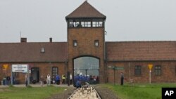 FILE - The entrance to the Aushwitz Birkenau former death camp is seen May 1, 2008. 